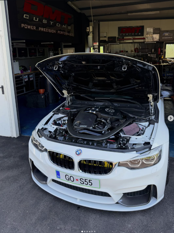 BMW F80 M3 GO S55 at the DMT Customs workshop with its bonnet open